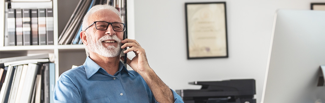 Senior businessman on mobile phone