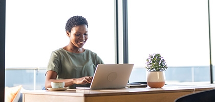 Businesswoman working on laptop in office