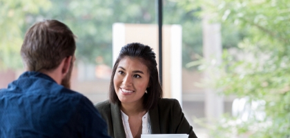 Banker talking with client in office