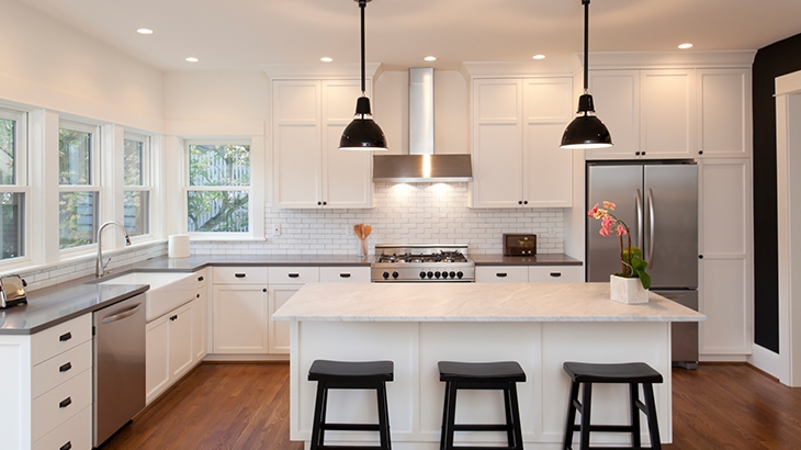 Large updated white kitchen with island.