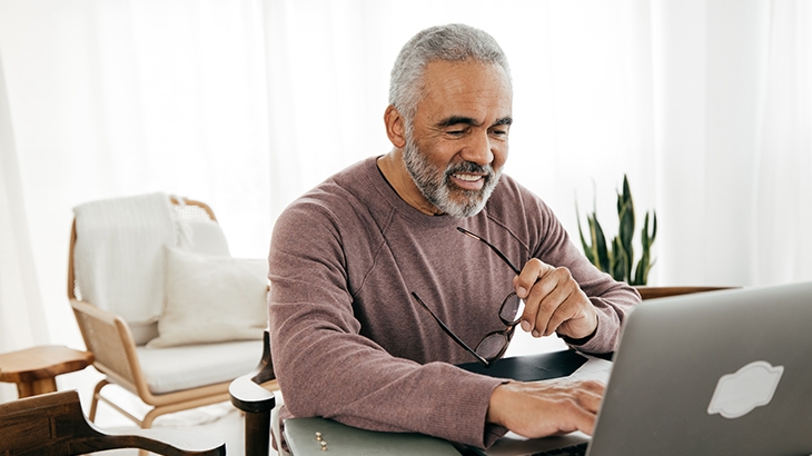 Man using laptop at home