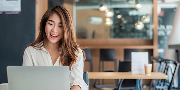 Businesswoman using her laptop in the office