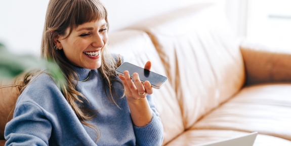 Cheerful woman speaking on a cellphone.