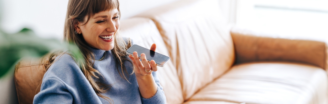 Cheerful woman speaking on a cellphone.