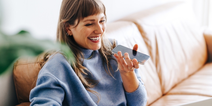 Cheerful woman speaking on a cellphone.