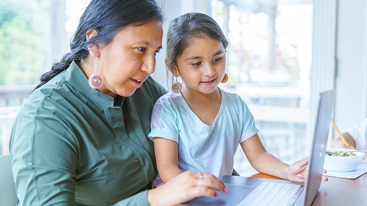 Woman and child online shopping.