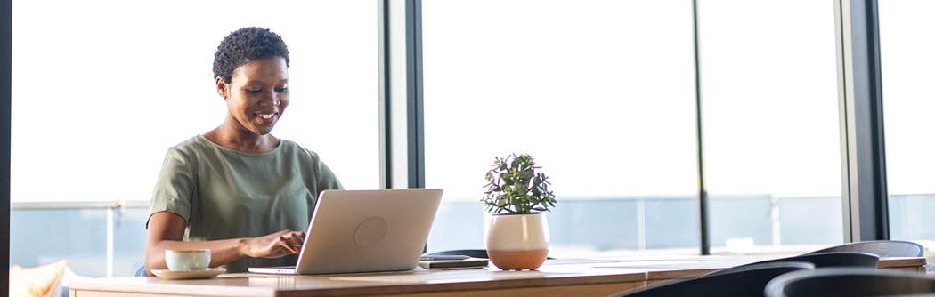 Businesswoman working on laptop in office