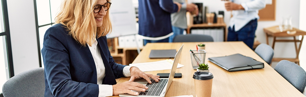 Woman working on laptop in an office