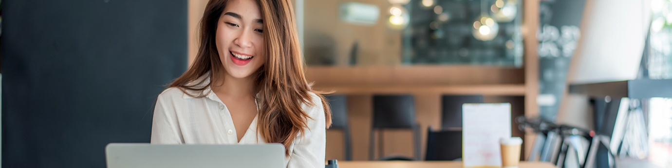 Businesswoman using her laptop in the office