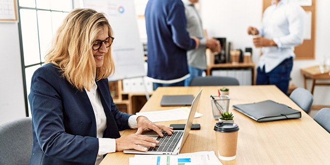 Woman working on laptop in an office