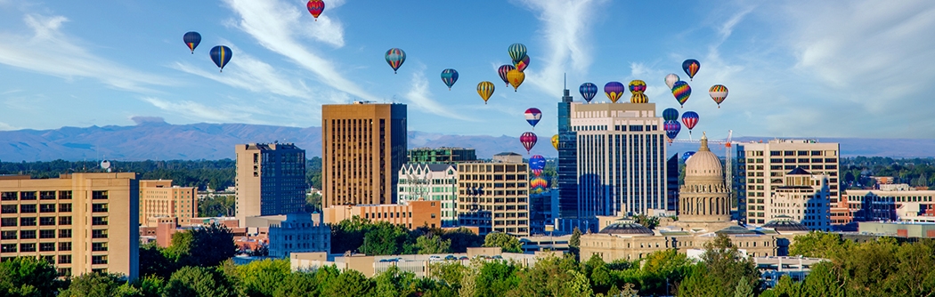 Downtown skyline in Boise, Idaho with hot air balloons.