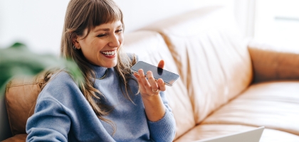 Cheerful woman speaking on a cellphone.