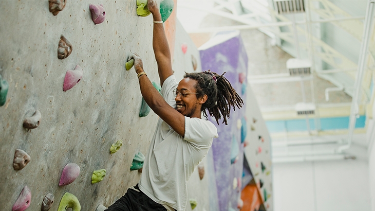 Man climbing an indoor climbing wall