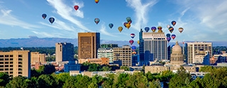 Downtown skyline in Boise, Idaho with hot air balloons.